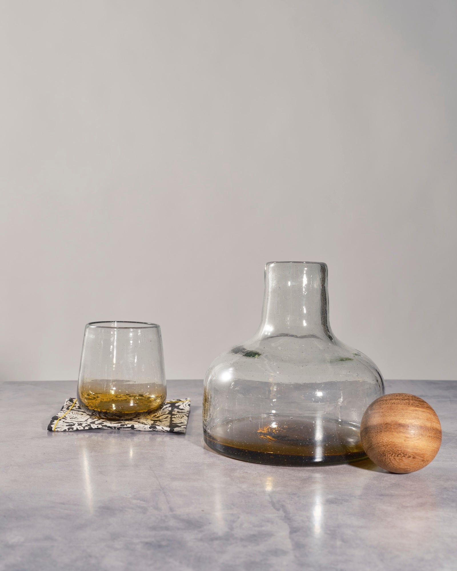 "Amber glass decanter with wood topper, decorative whiskey or liquor bottle"
