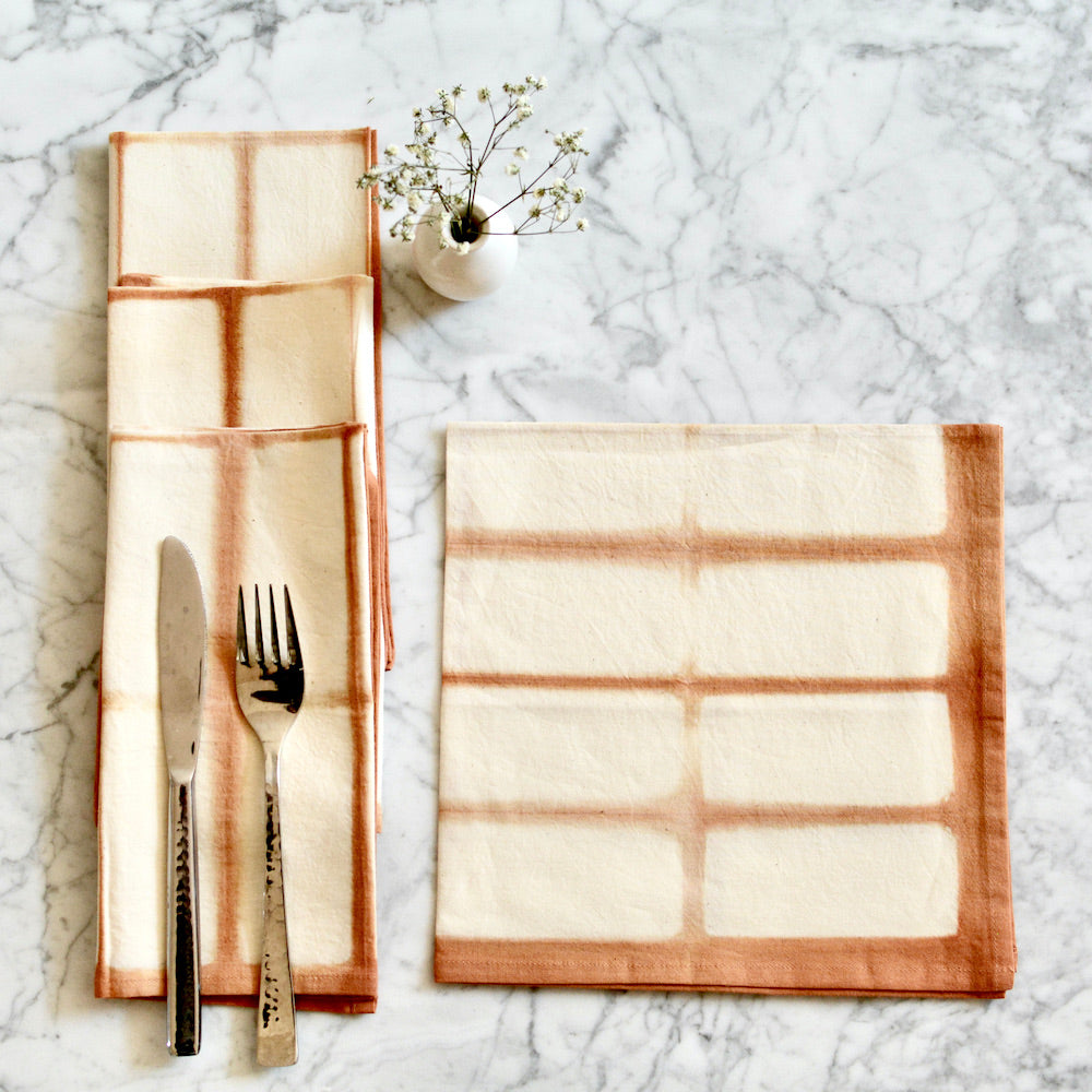 Eco-friendly amber Shibori cotton napkin with rectangle design for dinner setup