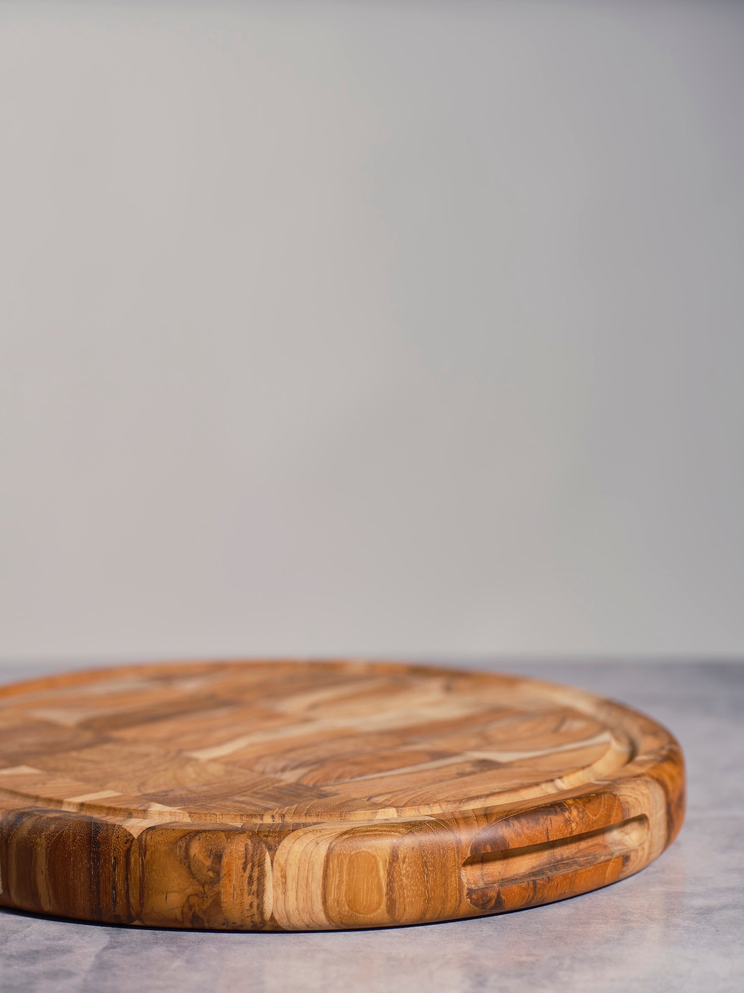 Round Teakwood Mosaic Board with natural wooden finish and handcrafted design