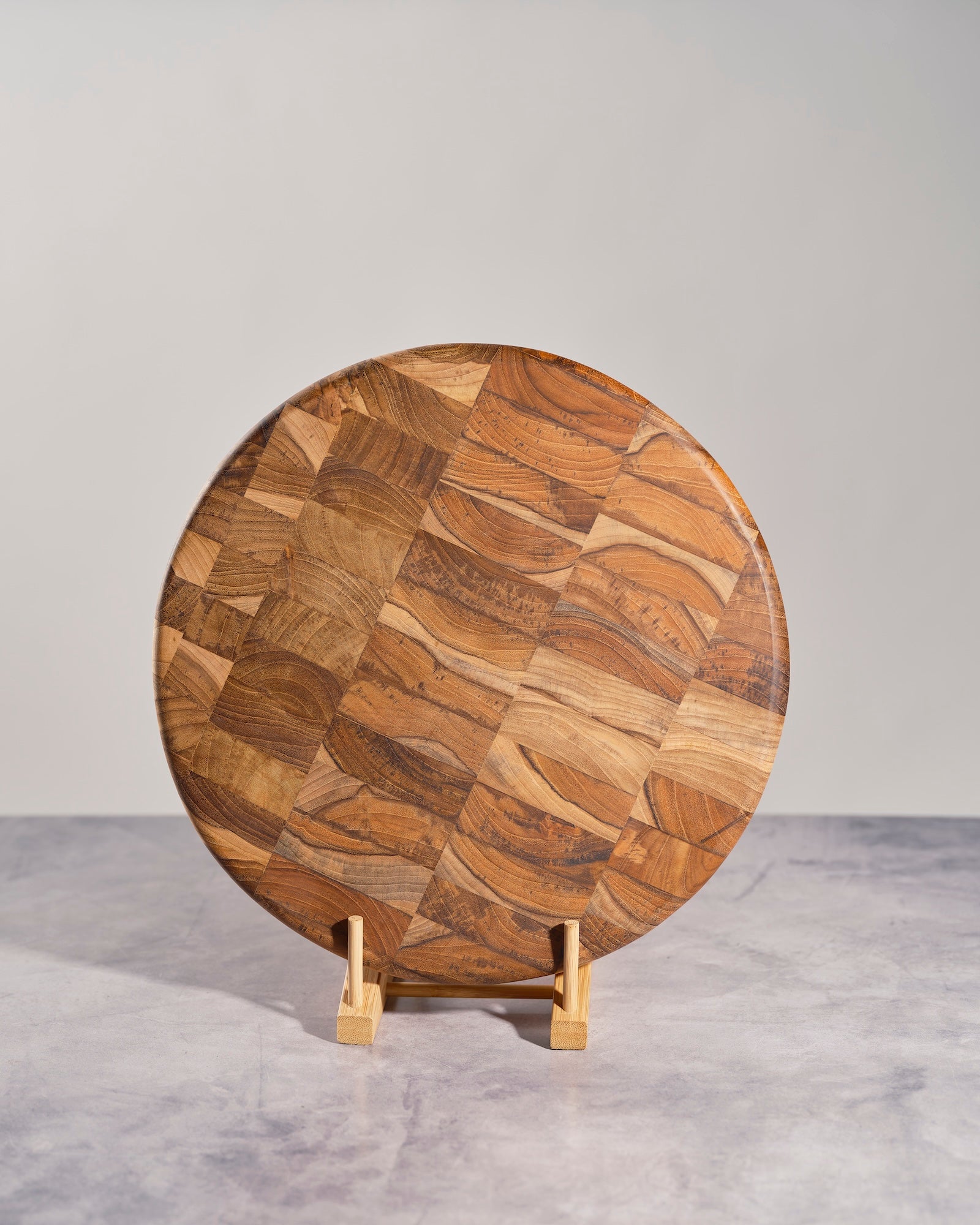 Round teakwood mosaic cheese board for serving and kitchen décor