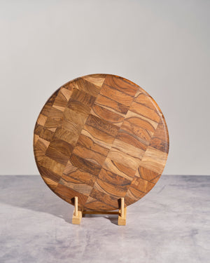 Round teakwood mosaic cheese board for serving and kitchen décor